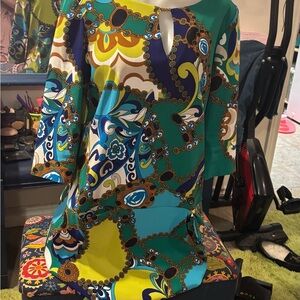 Vintage mini dress with front pockets.